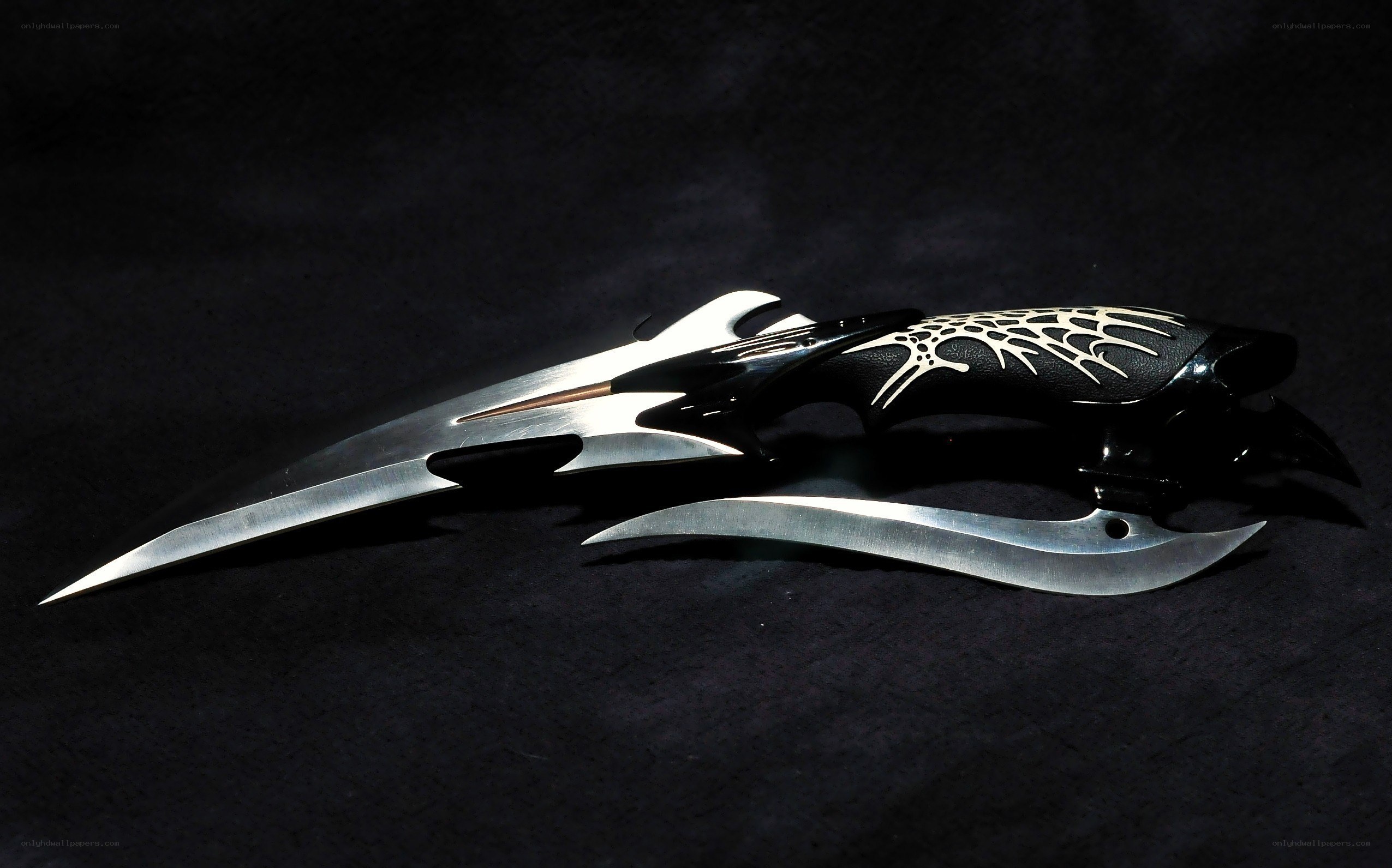 ornate black and silver knives