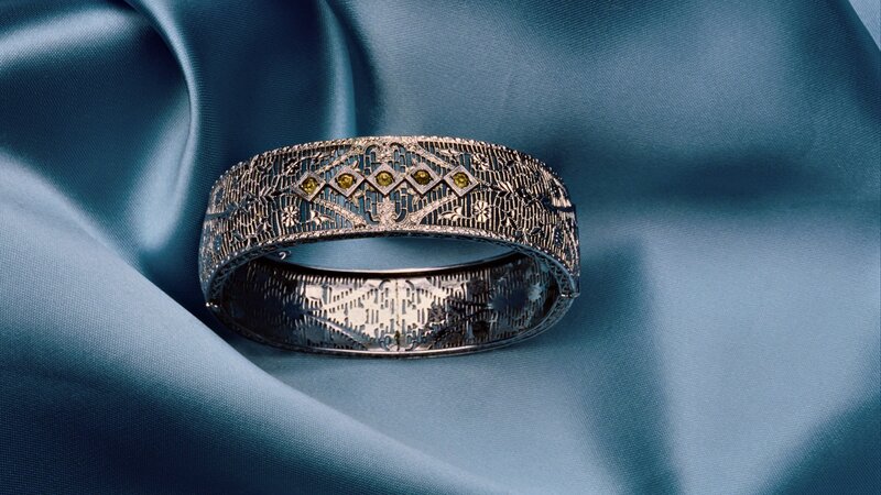 ornate bracelet on blue fabric