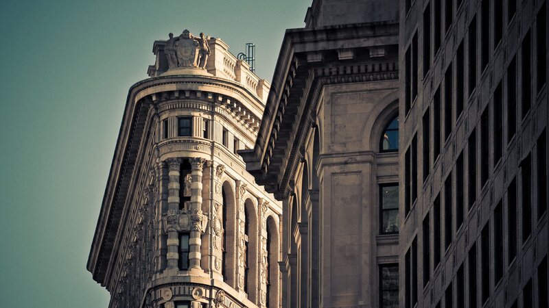 Ornate Building Corner — Gray, Dramatic, Afternoon