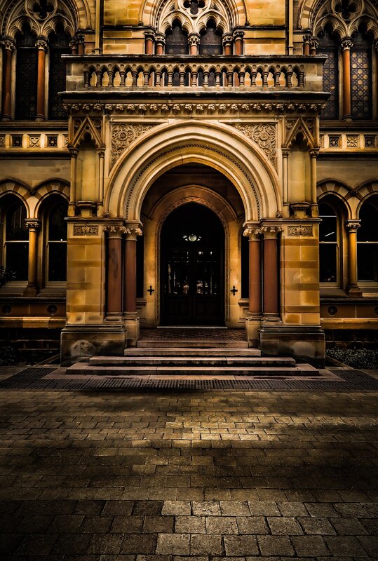 Ornate Building Entrance — Brown, Dramatic