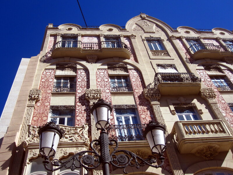 Ornate Building Facade — Beige, Dramatic, Afternoon