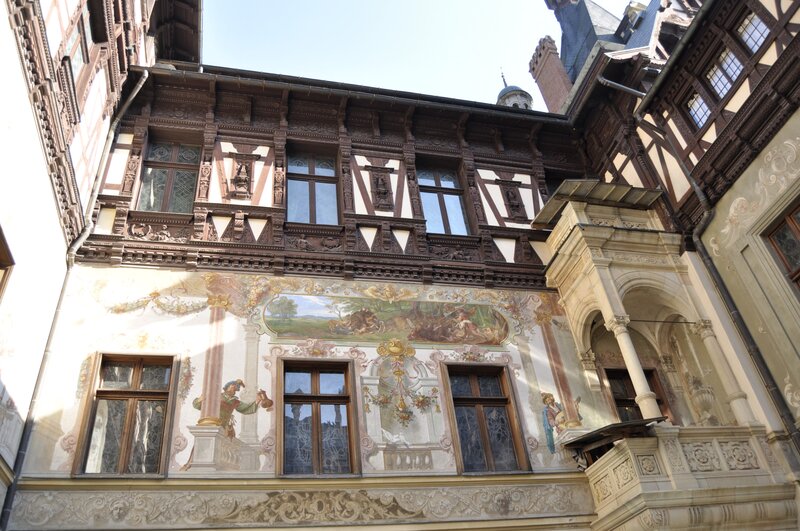 ornate building facade with frescoes