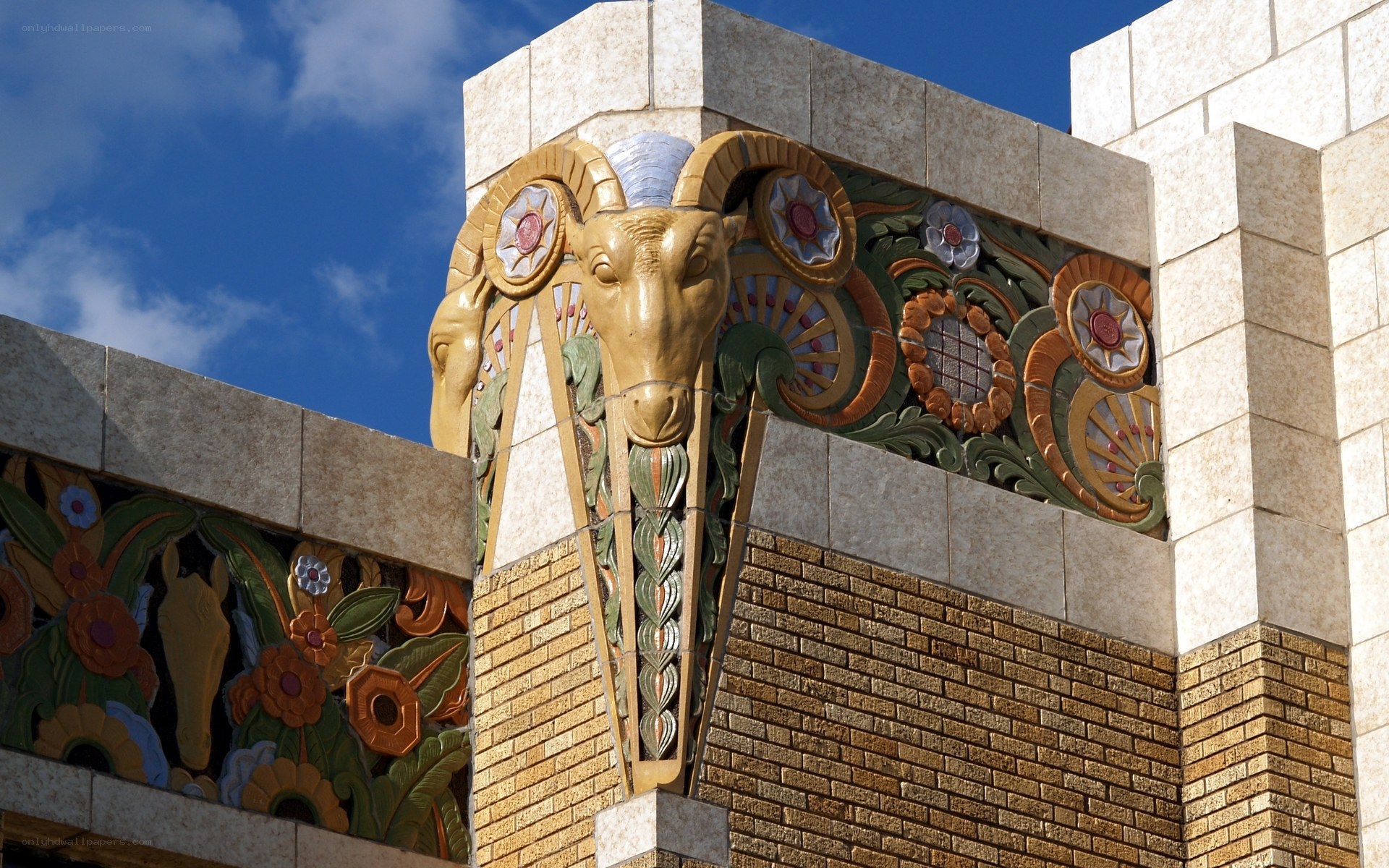 ornate building facade with ram sculpture