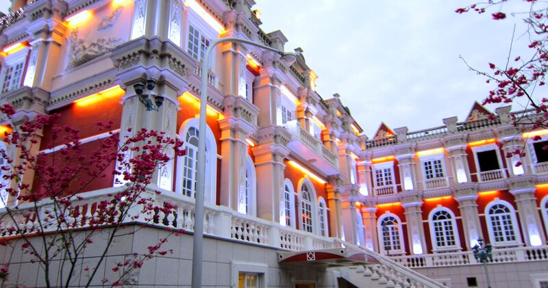 Ornate Building with Cherry Blossoms