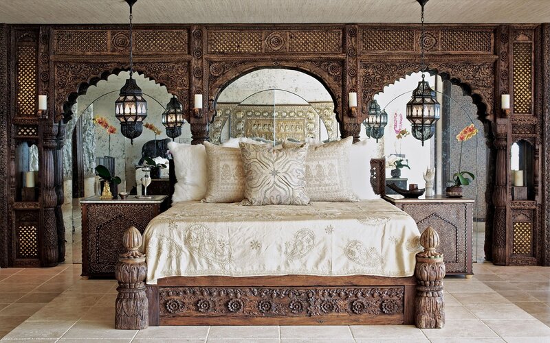 ornate carved wooden bed