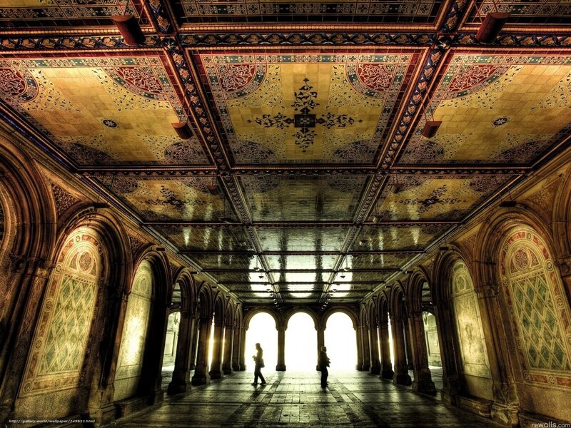 ornate ceiling in a stone corridor