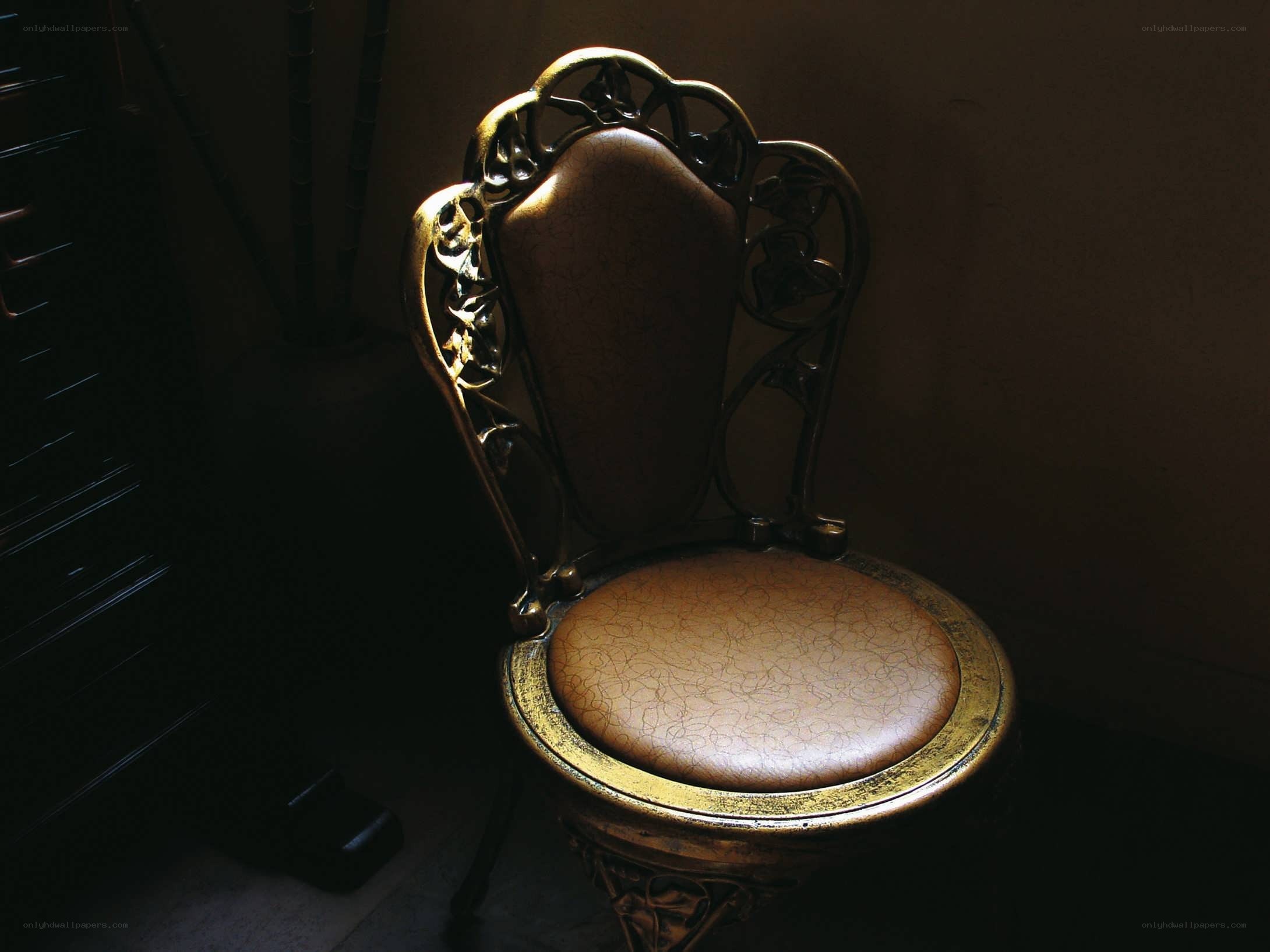 ornate chair in dim light