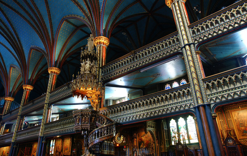 Ornate church interior with blue vaulted ceiling