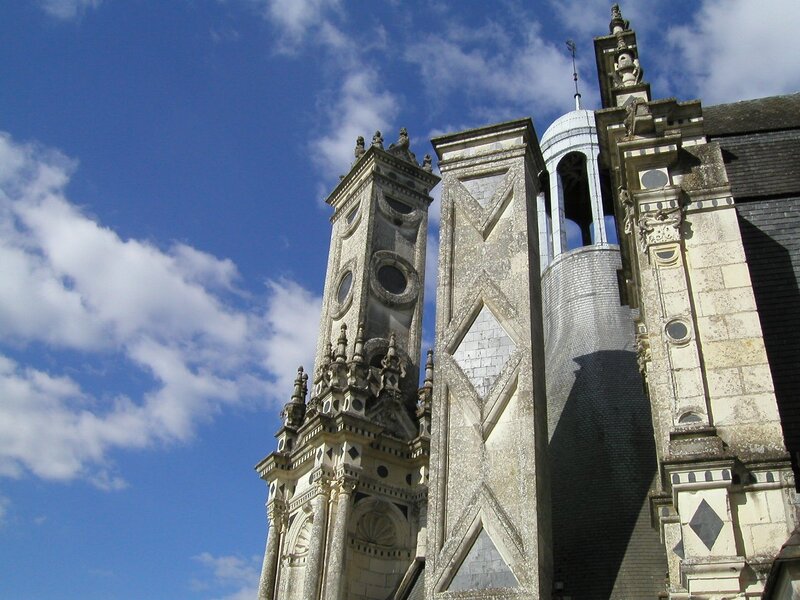 ornate church towers under blue sky