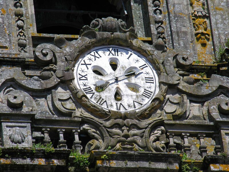 ornate clock on stone facade