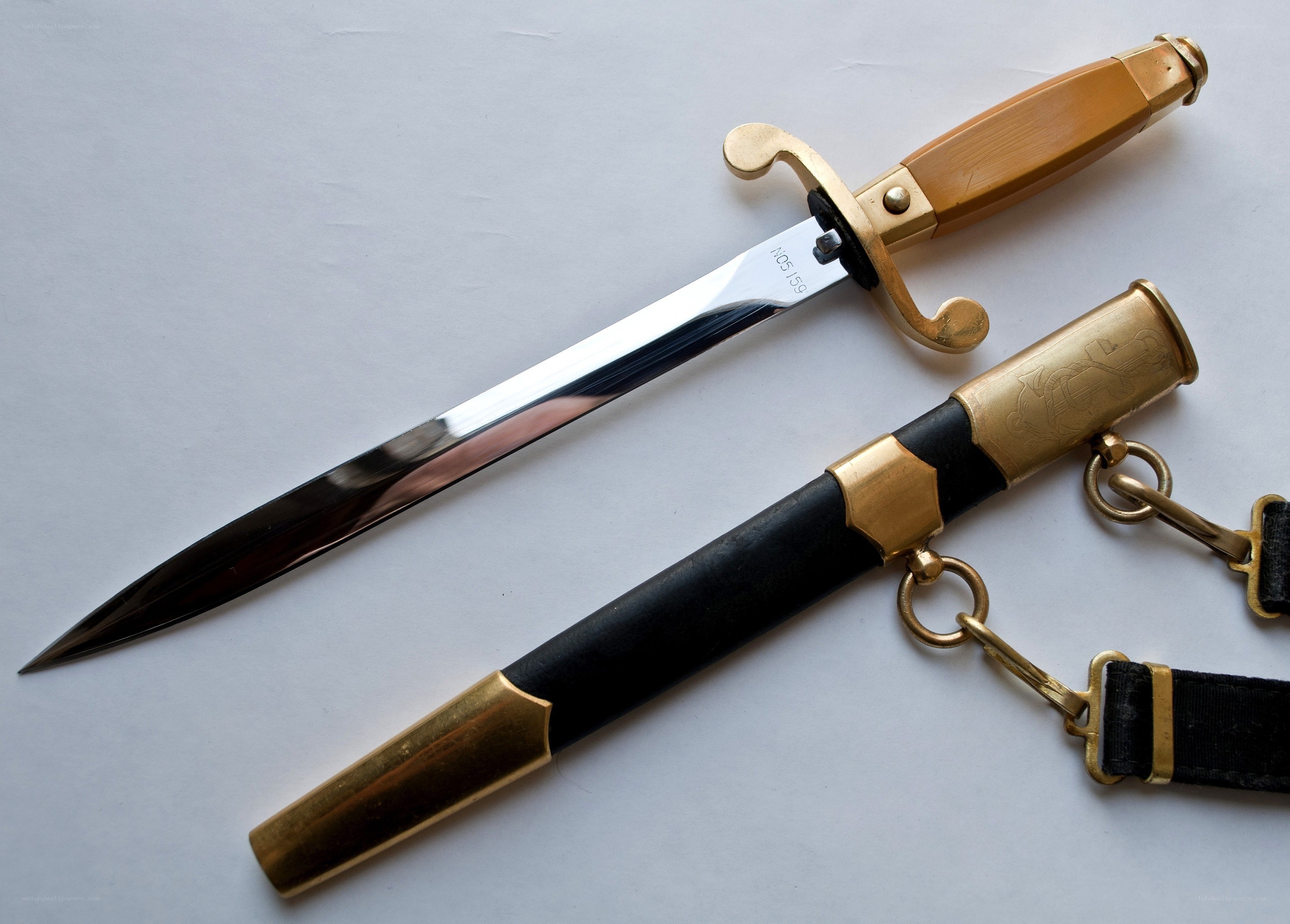 ornate dagger with scabbard