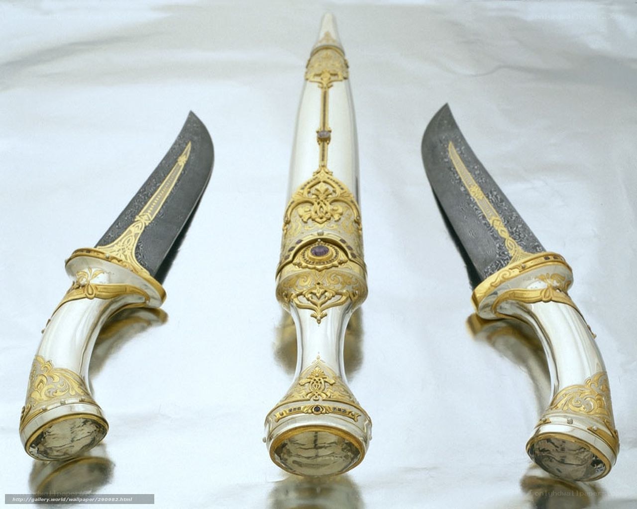 ornate daggers with gold inlay