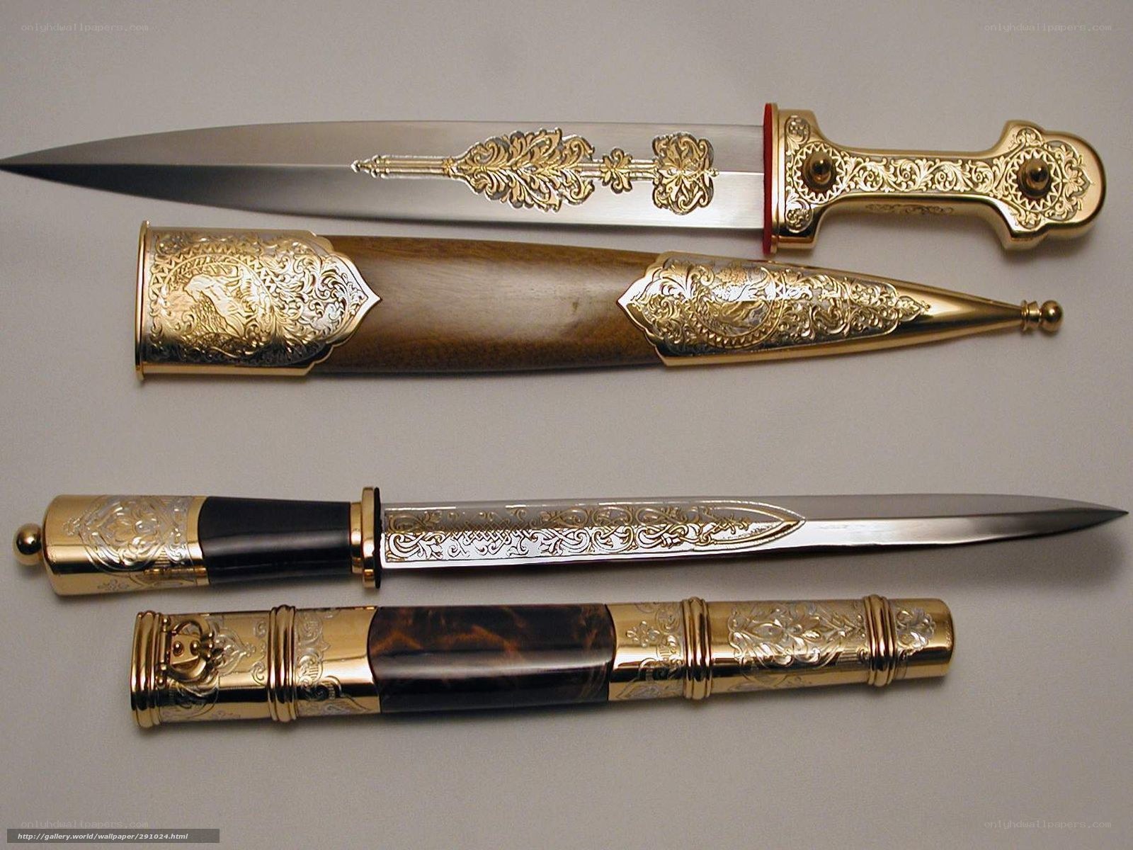 ornate daggers with scabbards