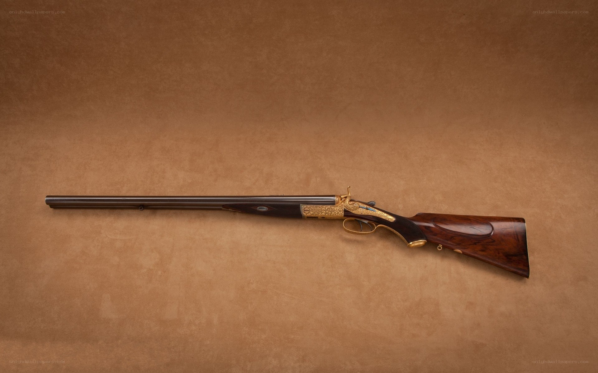 ornate double-barreled shotgun