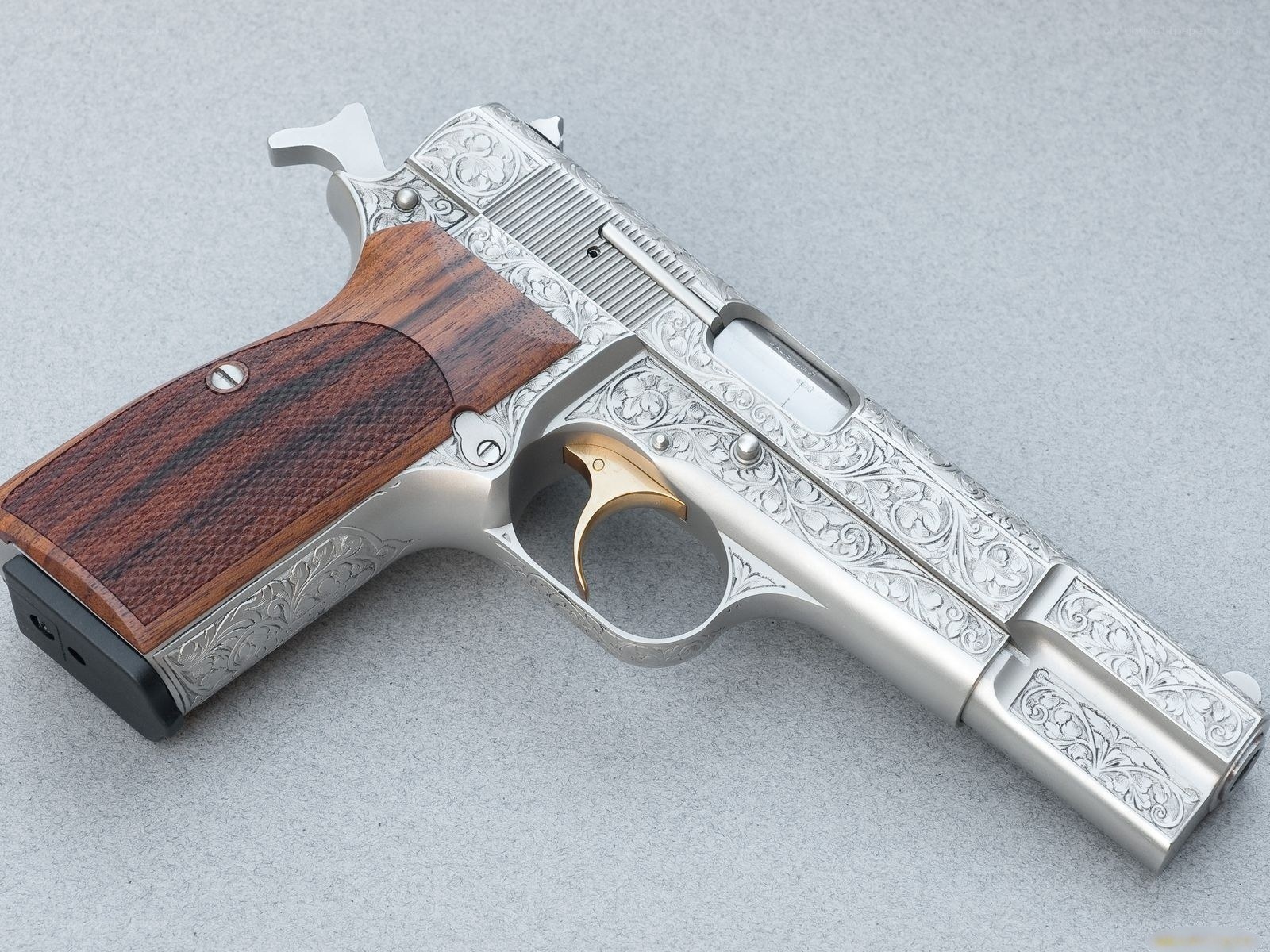 ornate engraved pistol