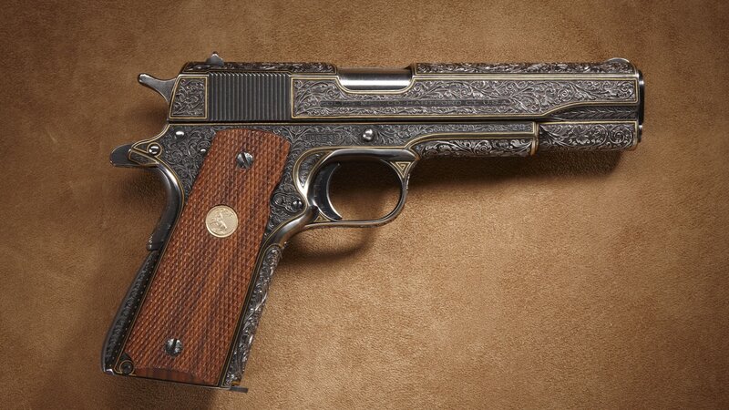 ornate engraved pistol