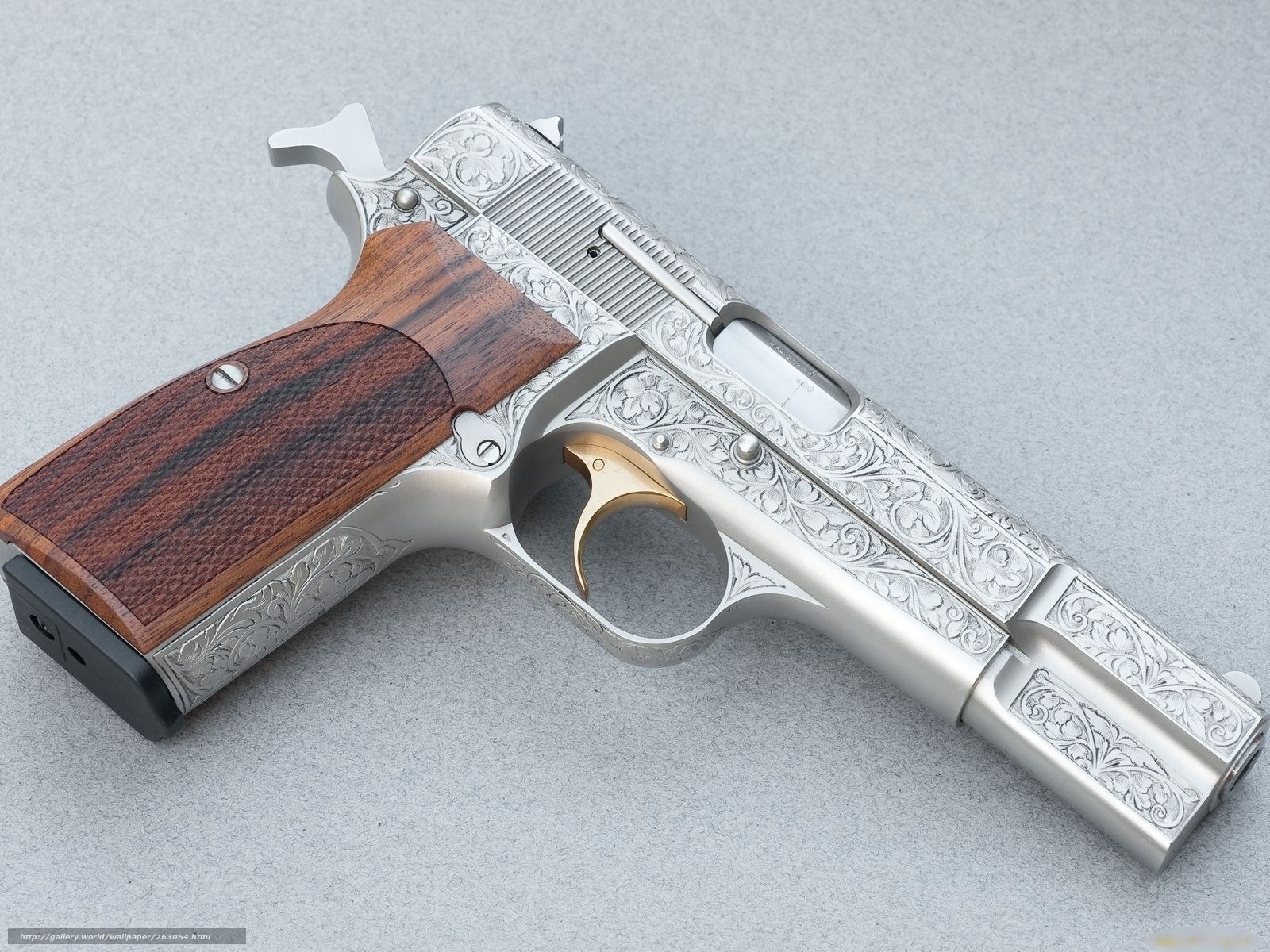 ornate engraved pistol