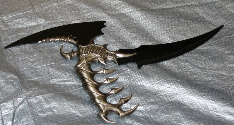 ornate fantasy dual-bladed weapon