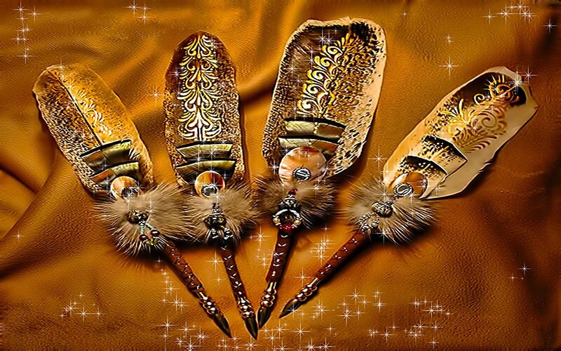 ornate feathered staffs
