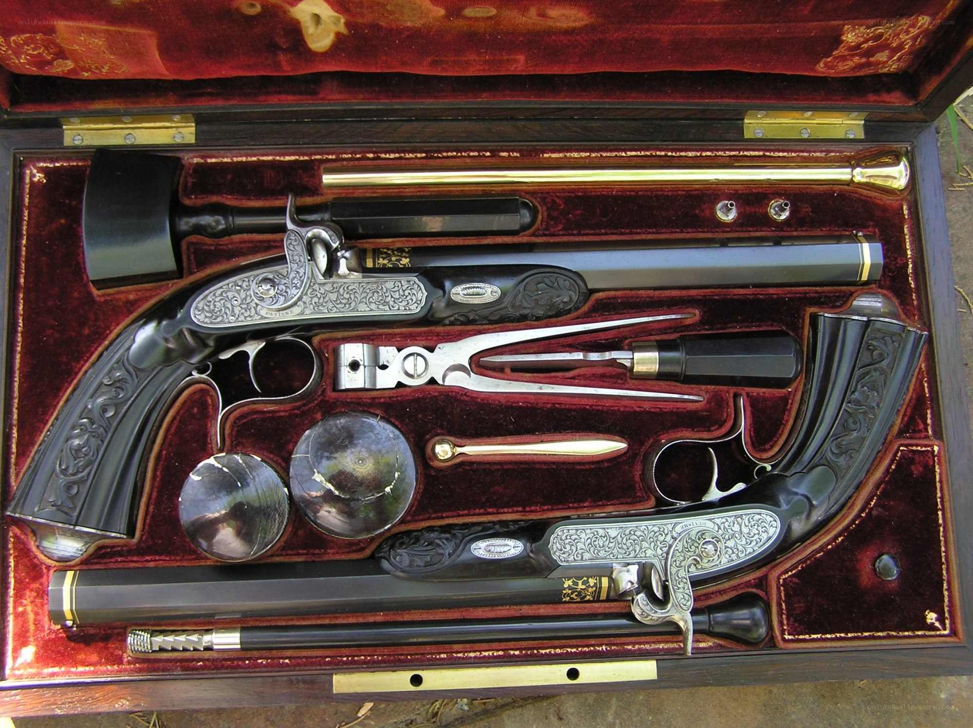ornate flintlock pistols in case