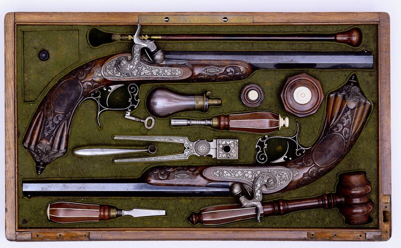 ornate flintlock pistols in case