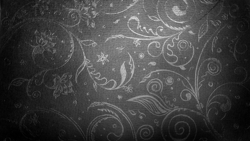 ornate floral pattern on dark background