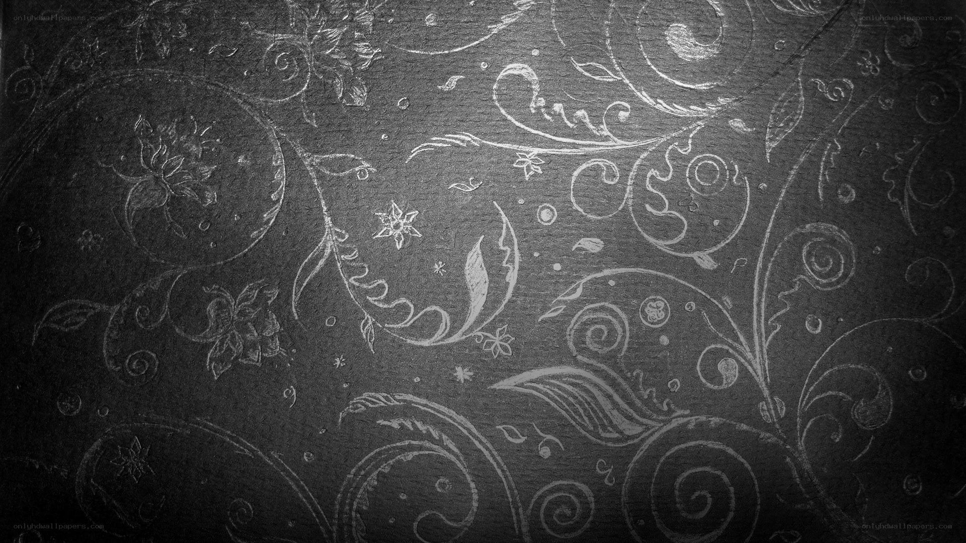 ornate floral pattern on dark background