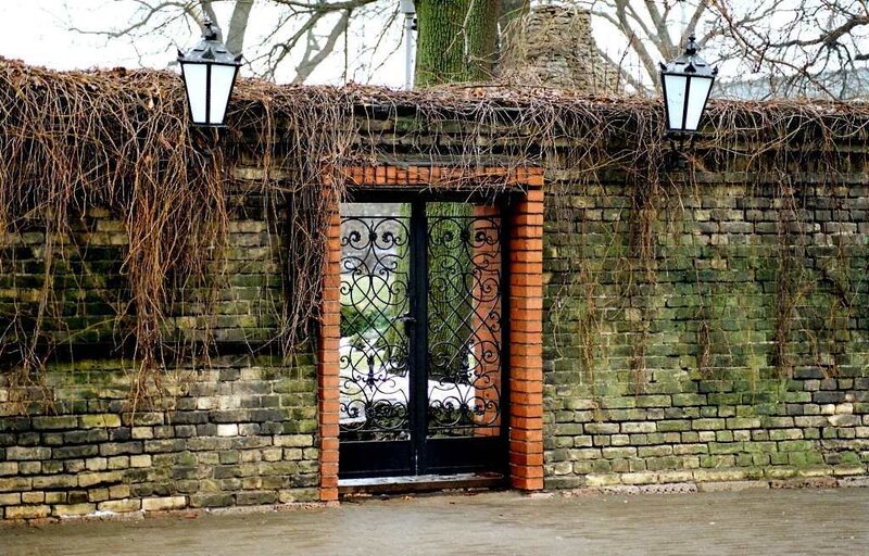 Ornate Gate in Brick Wall