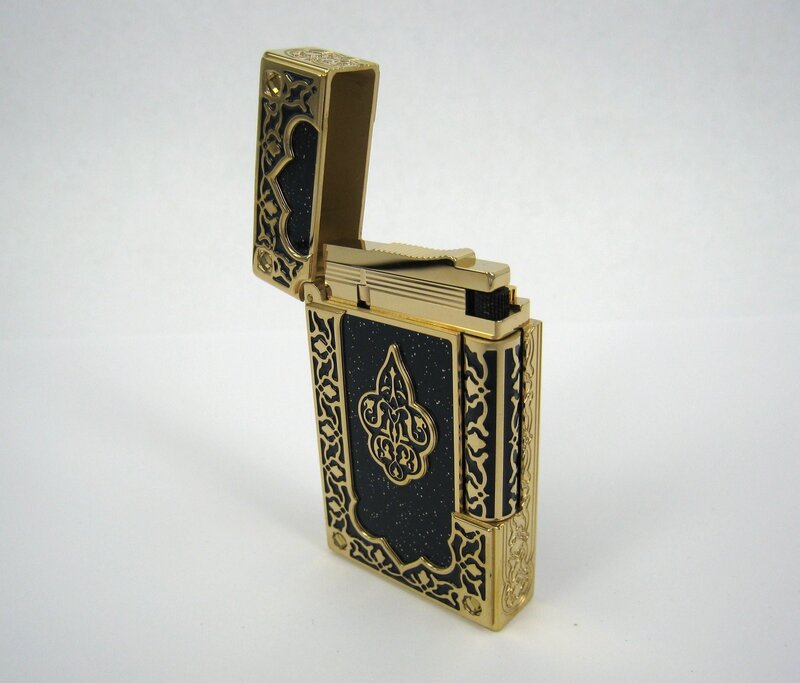 ornate gold and black lighter