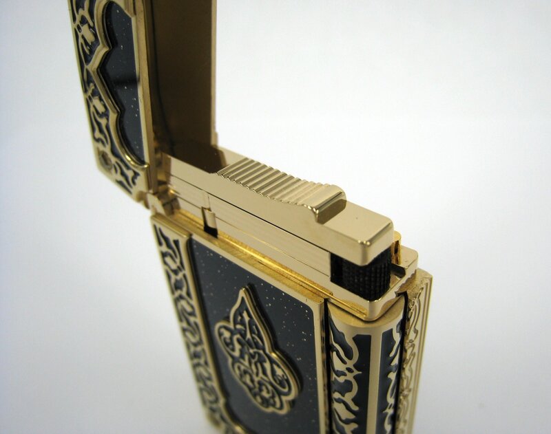 ornate gold and black lighter