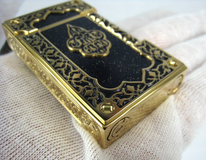 ornate gold and black lighter