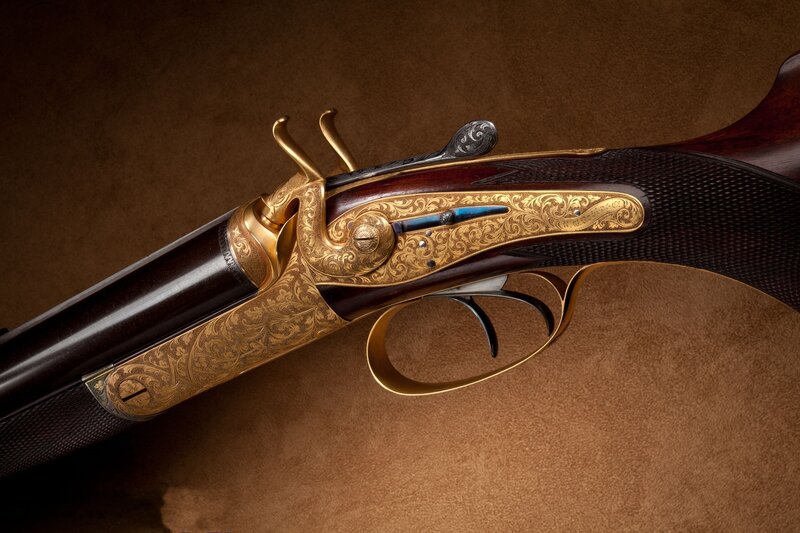 ornate gold-engraved shotgun
