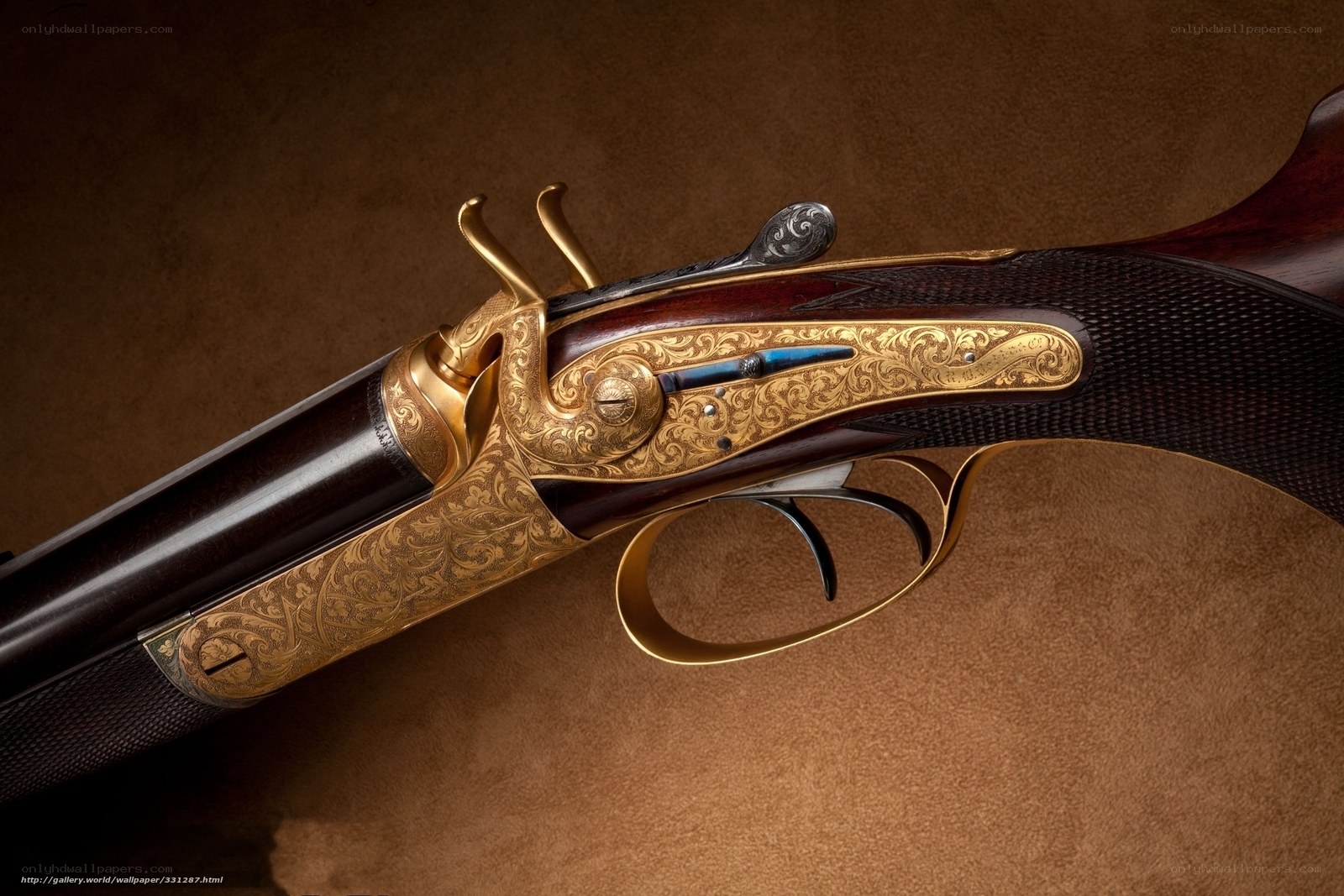 ornate gold-engraved shotgun