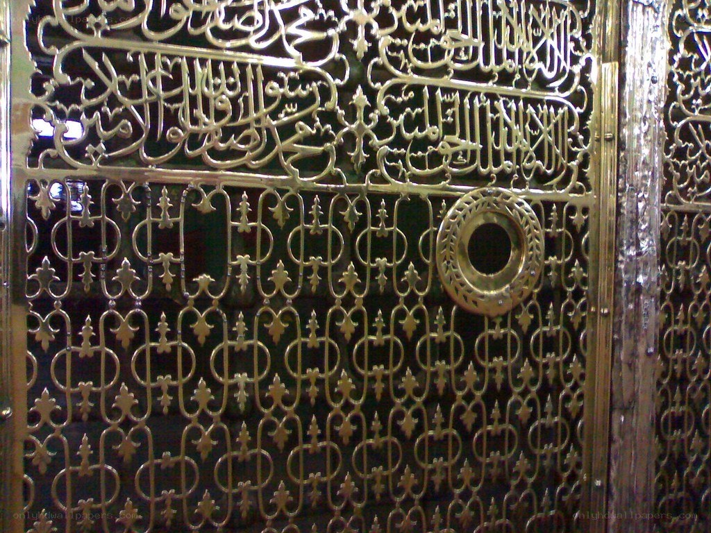 ornate golden gate with calligraphy