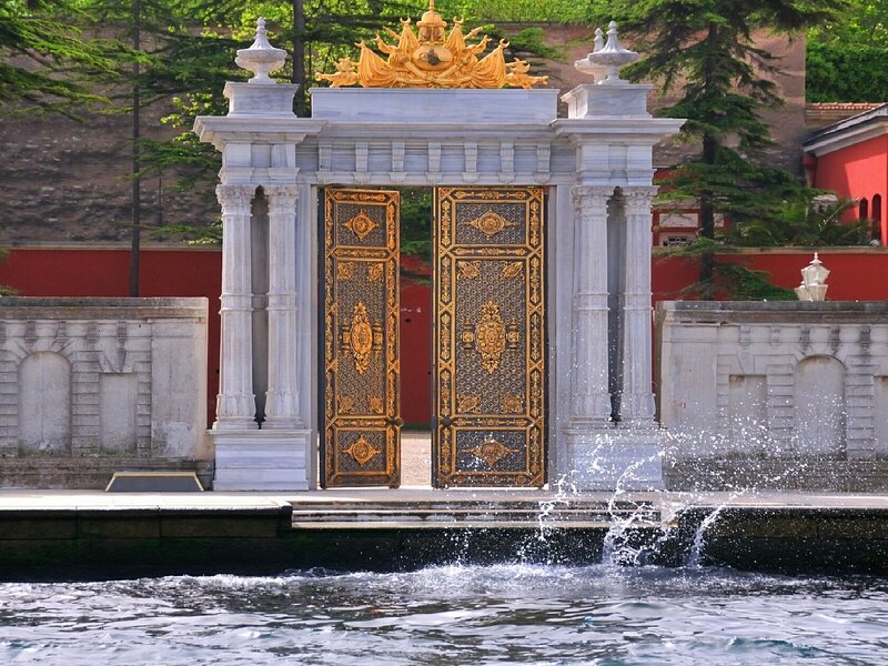 Ornate golden gates at a palace