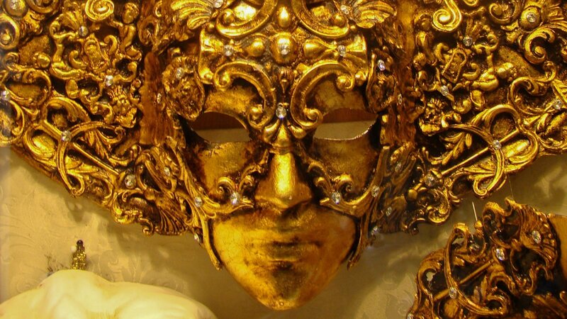 ornate golden mask with jewels