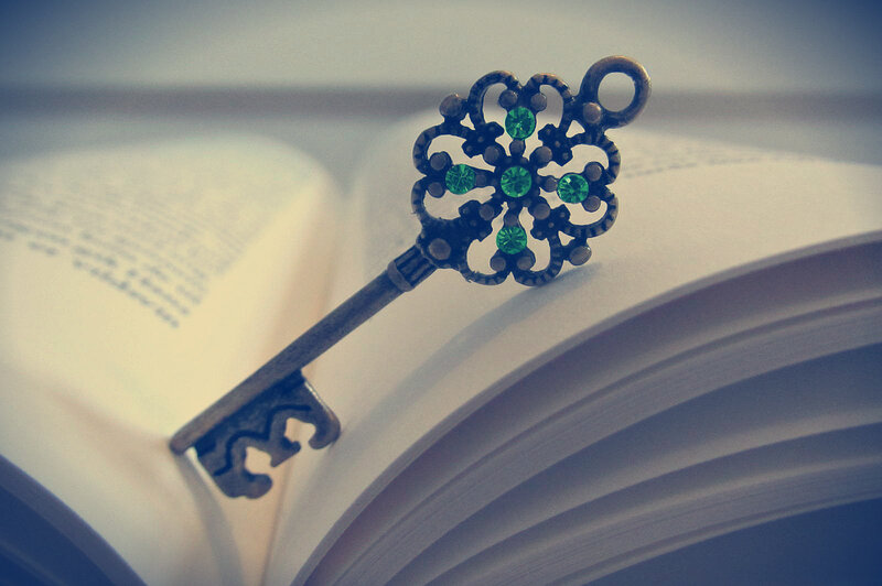 Ornate Key on Book — White