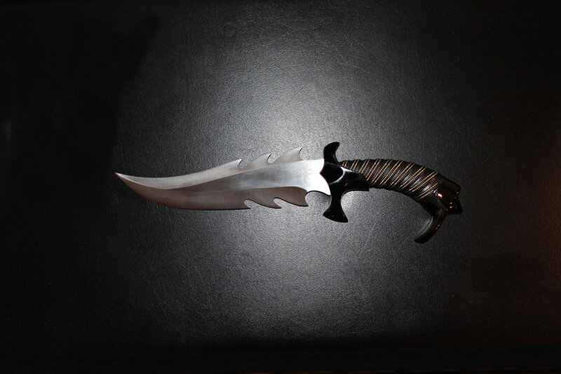 Ornate Knife on Black Surface