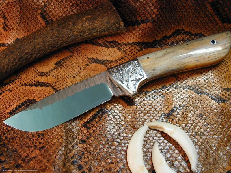 ornate knife on snake skin