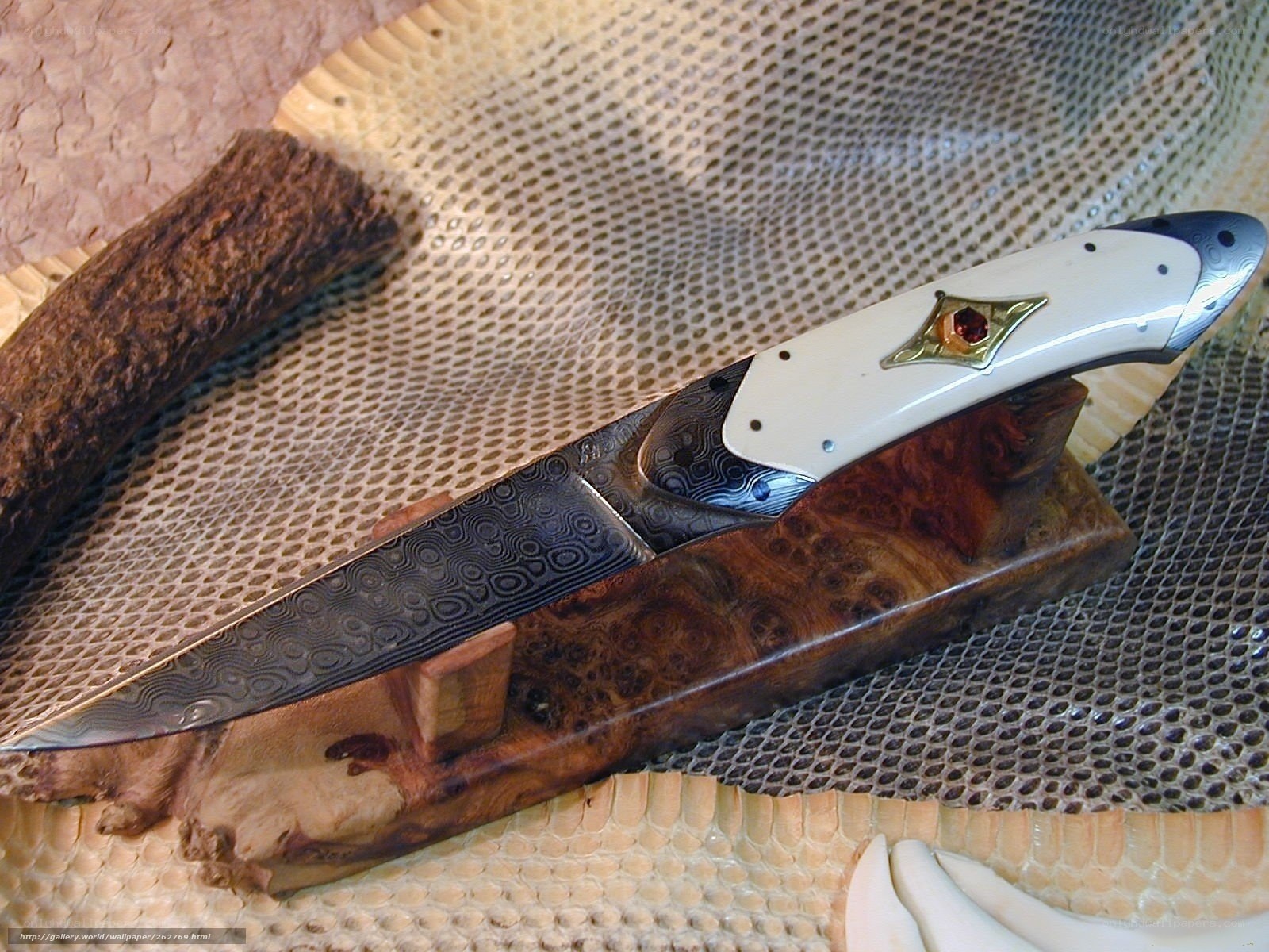ornate knife on wooden stand