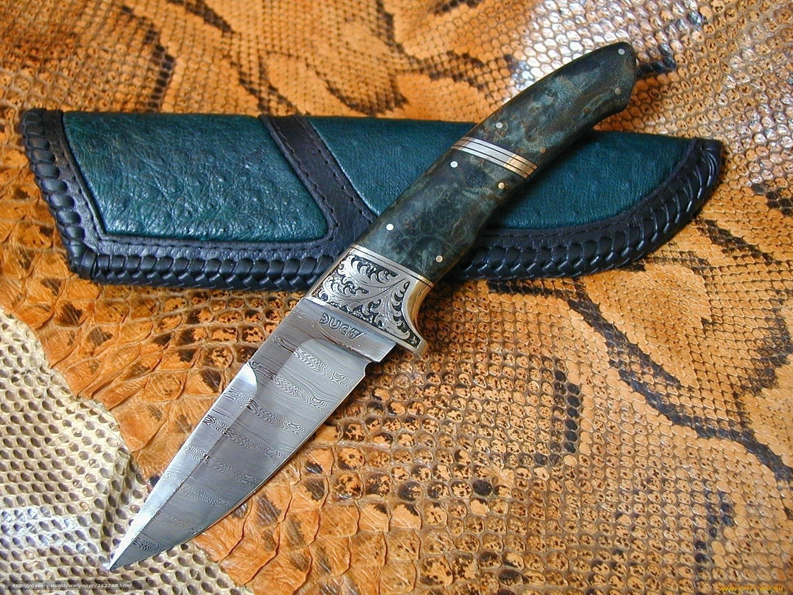 ornate knife with leather sheath