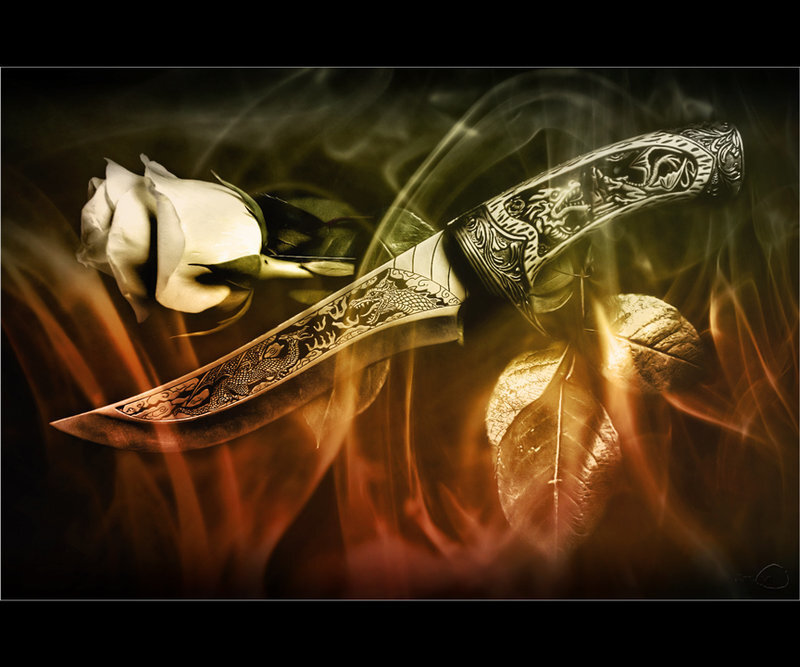 ornate knife with white rose