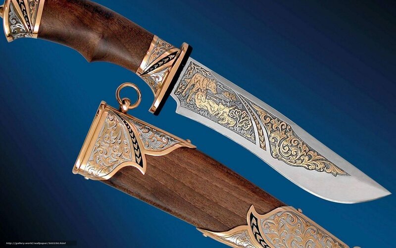 ornate knife with wooden handle