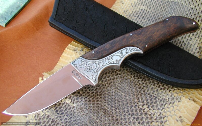 ornate knife with wooden handle