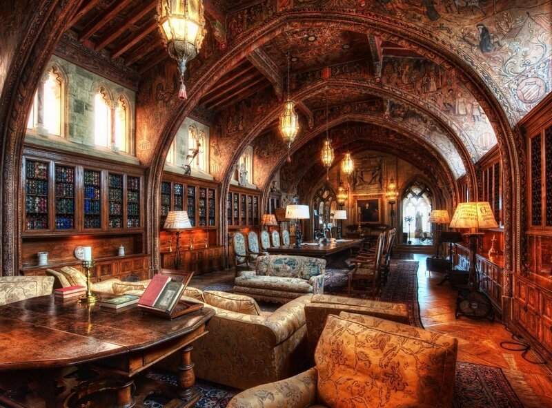 Ornate Library Room — Brown, Dramatic, Photograph, Bookshelves, Armchairs, Carpet, Chandeliers