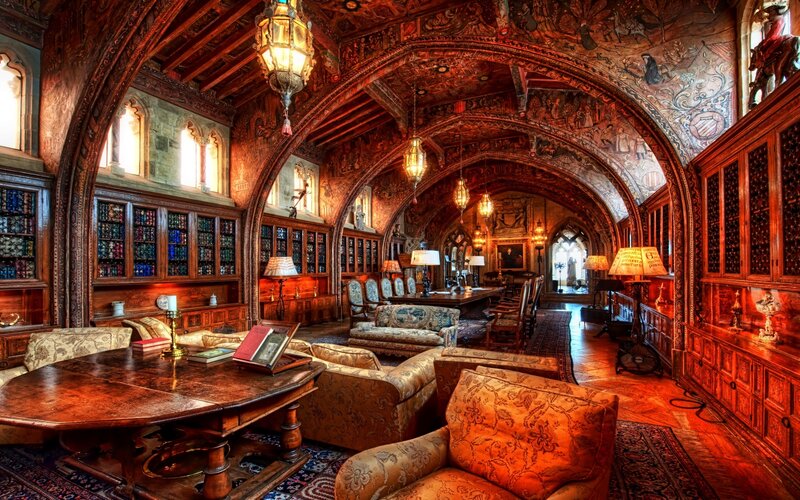 Ornate Library Room — Brown, Dramatic, Photograph, Bookshelves, Armchairs, Carved Ceiling