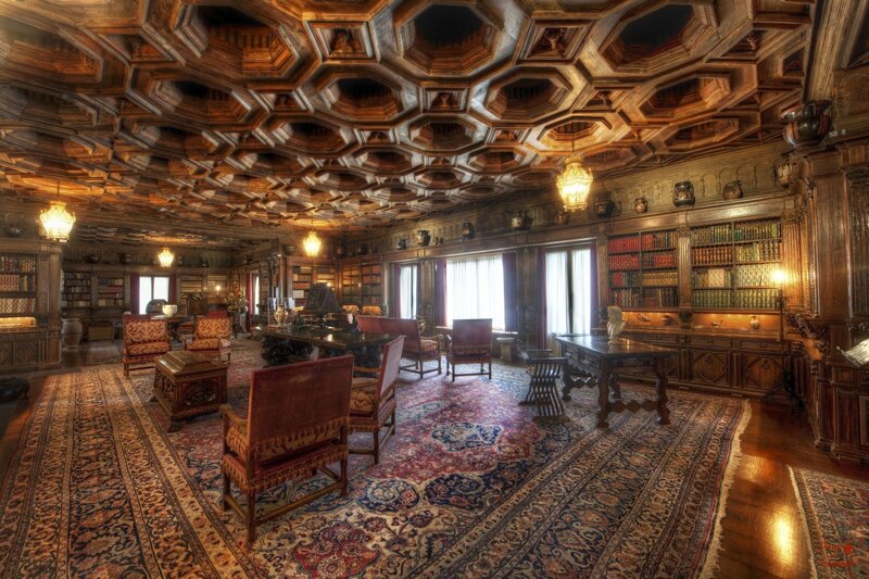 Ornate library with coffered ceiling
