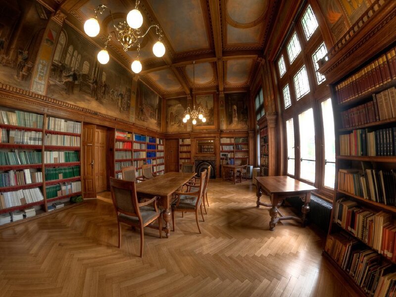 ornate library with wooden tables