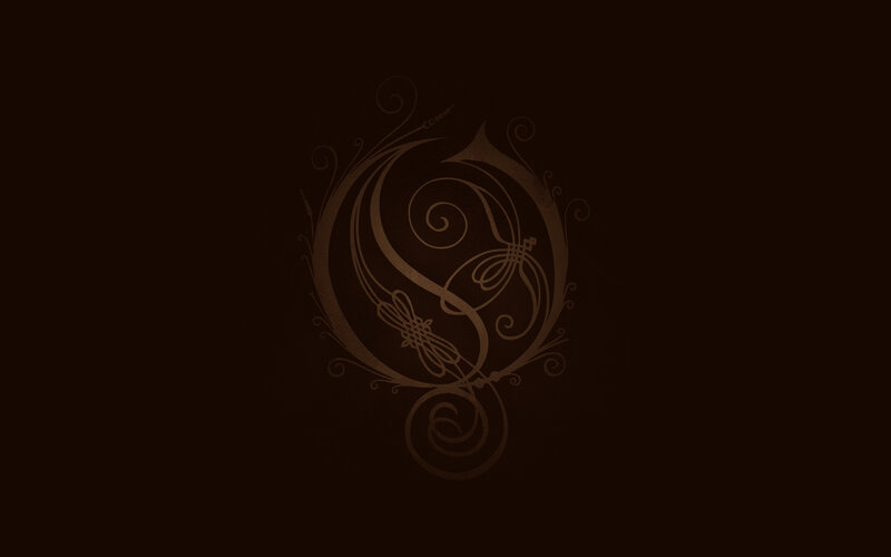 ornate logo on dark background