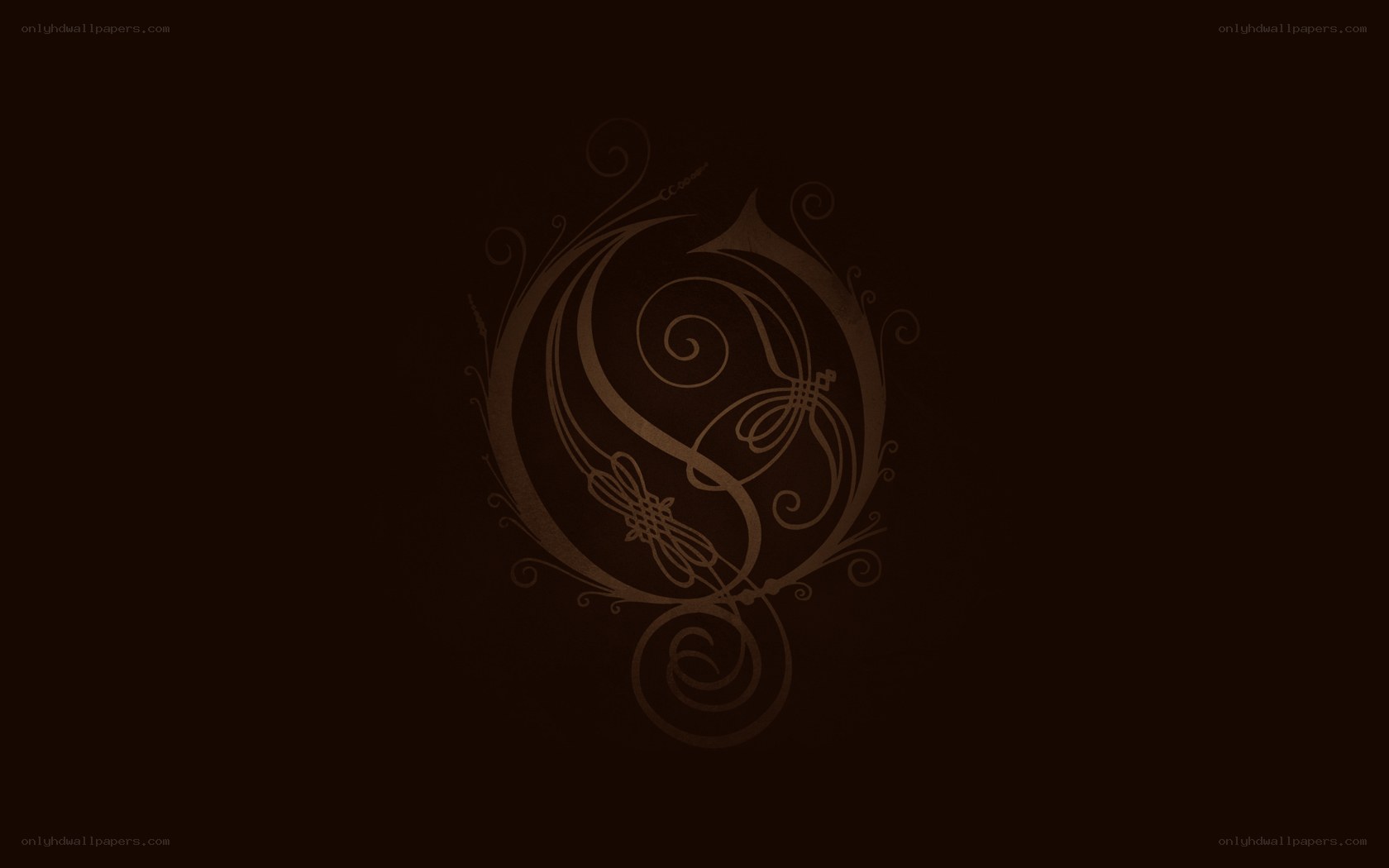 ornate logo on dark background